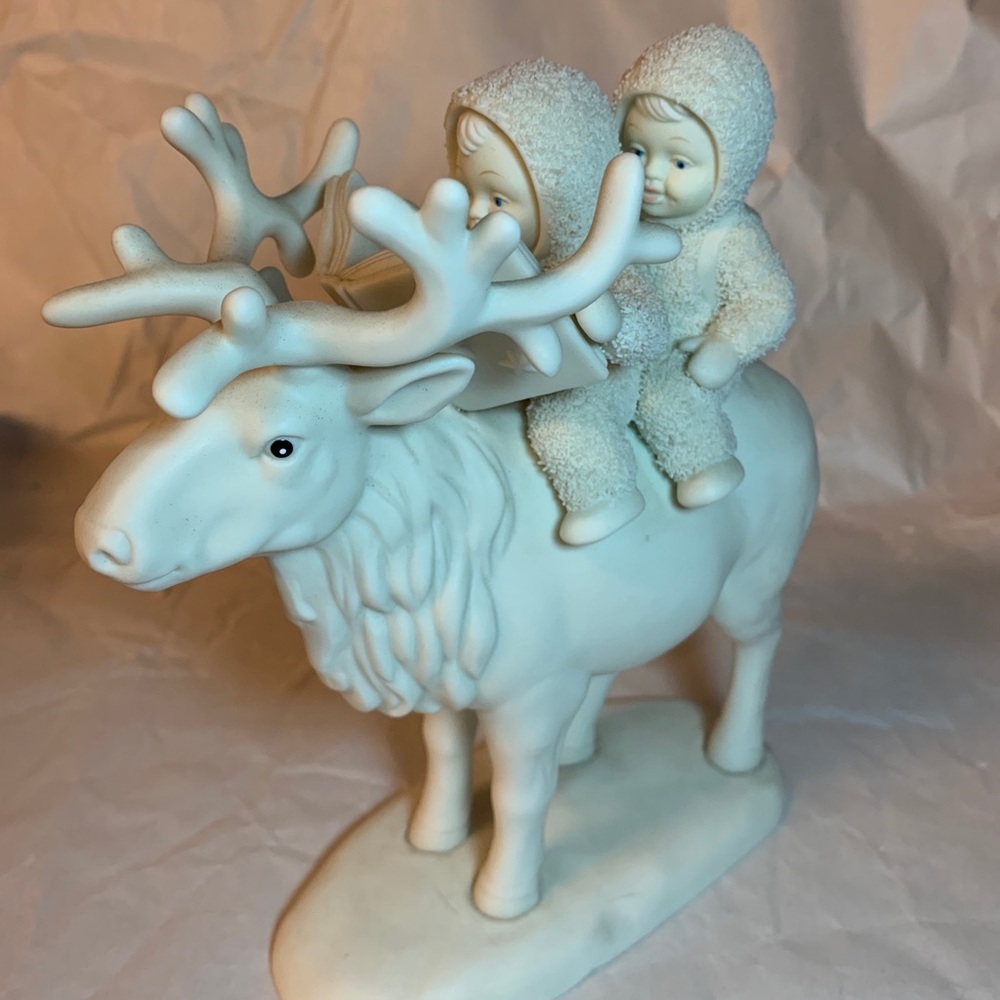 Department 56 Snowbabies. Two babies sitting on a caribou.